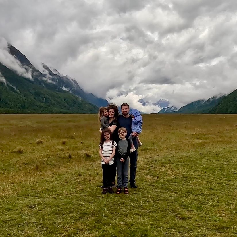 Family in front of Milford Sound