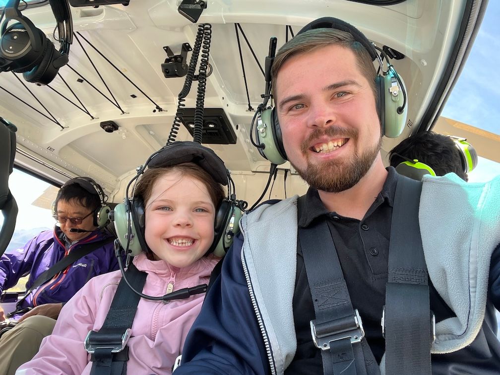 Picture of Aaron and daughter in helicopter