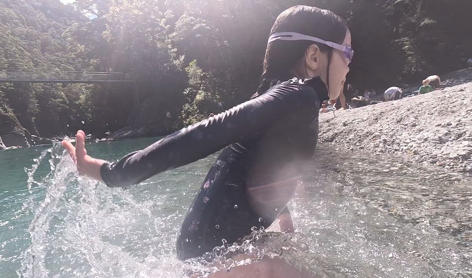 Daughter running out of the pool