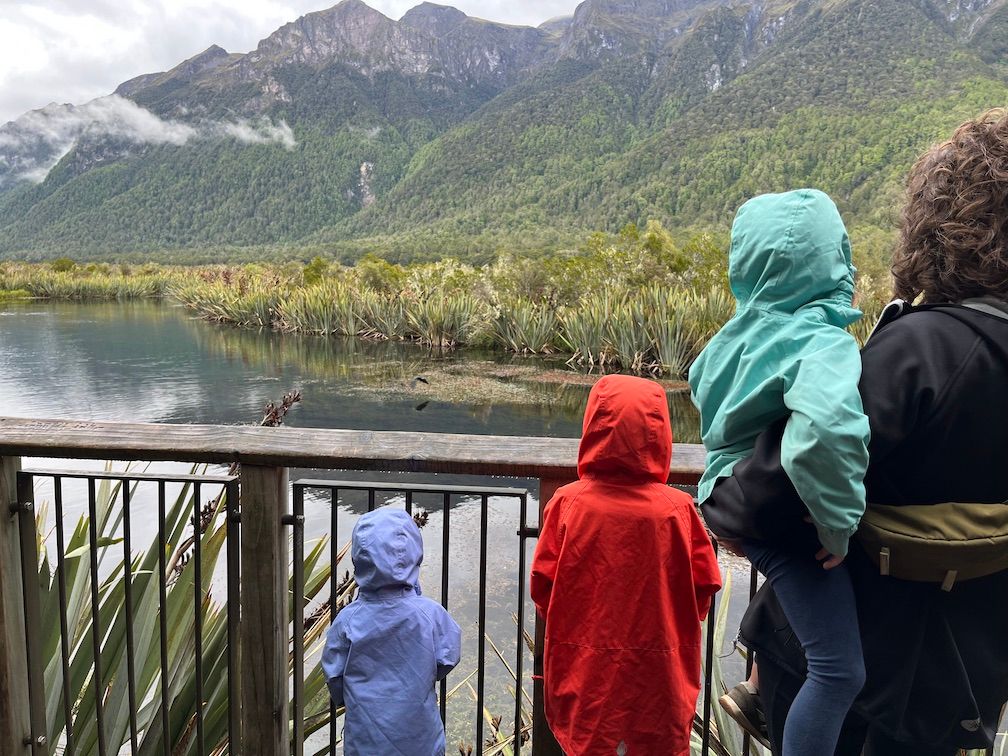 Family in front of mirror lakes