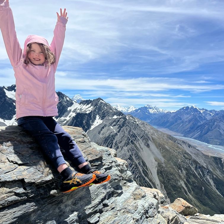 Girl on top of a mountain in Mt Cook National Park